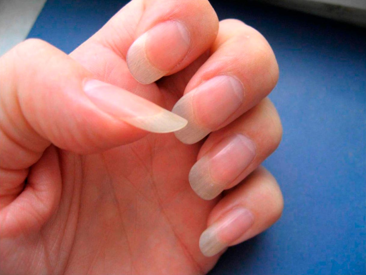 Back scratching with long pink nails